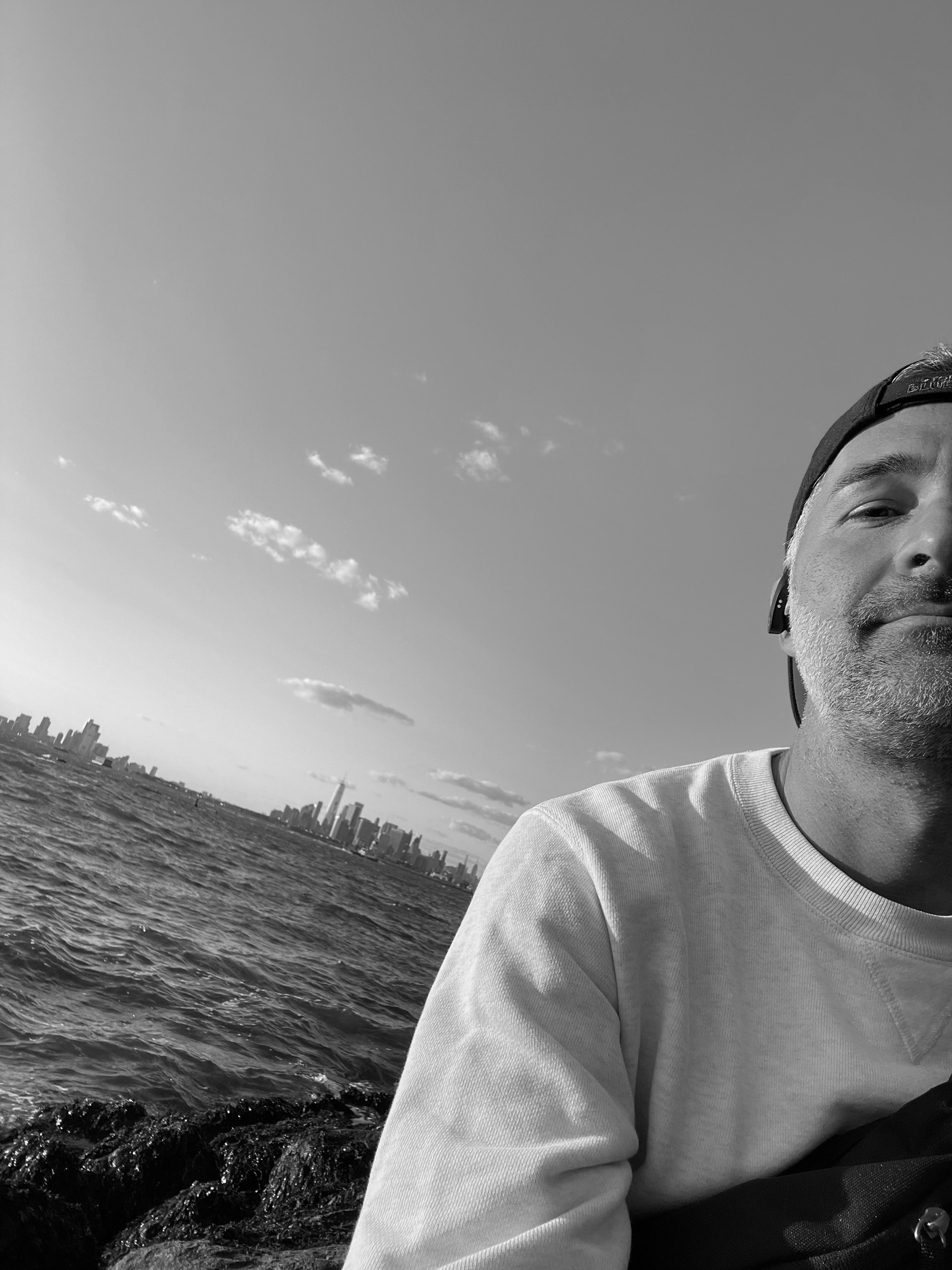 selfie with upper NY bay in the background during the evening golden hour